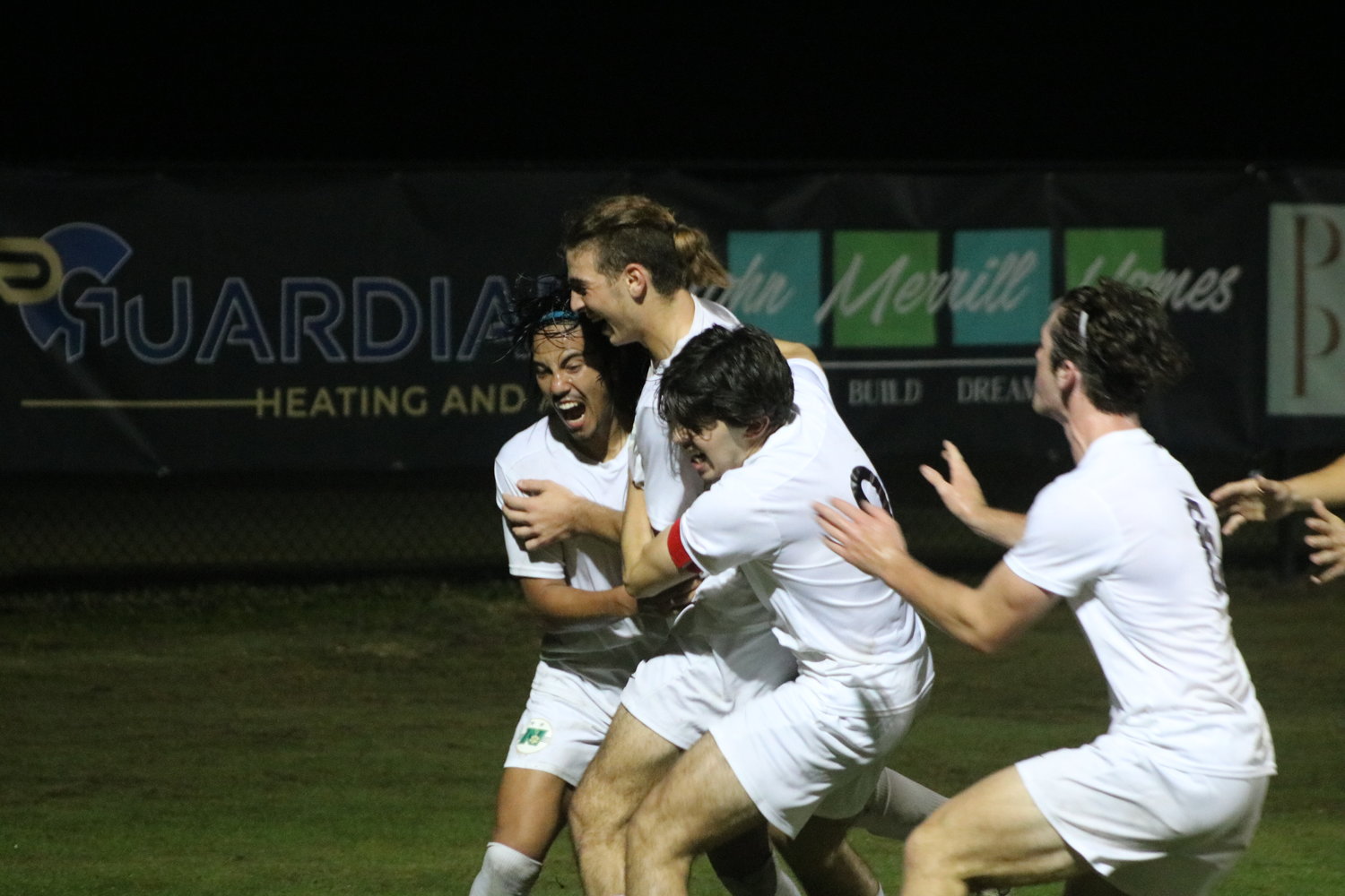 Nease’s Tyler Ghazanfari (middle) is swarmed by teammates after scoring the game-tying goal in the 73rd minute against Ponte Vedra on Dec. 7.